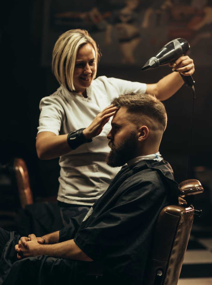 young-bearded-man-getting-haircut-by-hairdresser.jpg after hair cut